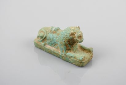 null A Ptolemaic style amulet of a reclining lion, symbol of the king, guardian and...