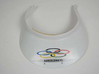 null Olympic Games. BARCELONA: White plastic visor with Olympic rings in mention...