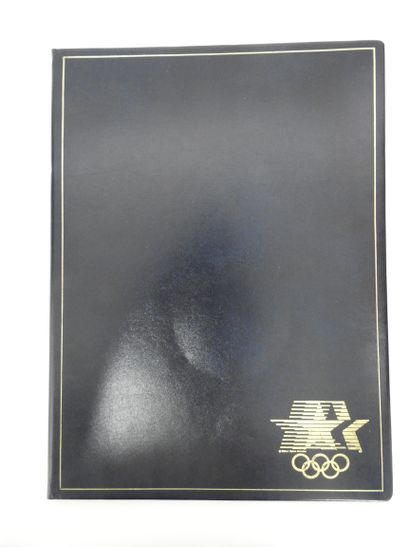 null Olympic Games. Black leather desk pad with gold piping and gold Olympic symbols...