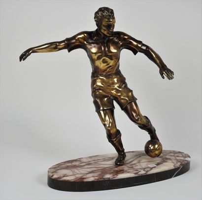 Football. Sculpture Football player in gilded...