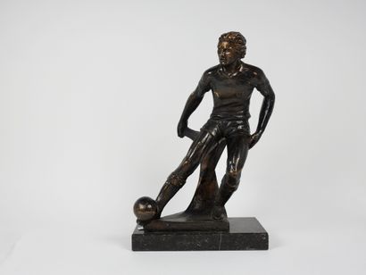 null Football. Trophy. Impressive player from the 1970s. On its polished stone base...