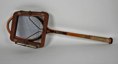 null Tennis racket. J. Wallez long palm racket, light brown and black with its wood...