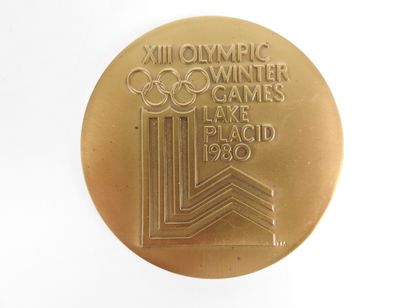 null Olympic Games. LAKE PLACID

Organizing Committee Medal

Obverse: sun, rings...