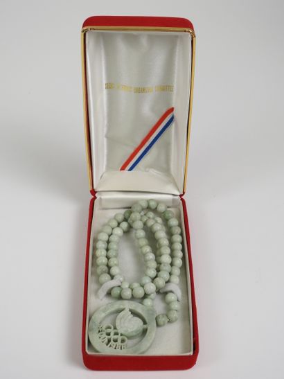 null Olympic Games. Necklace with jadeite medallion in the center spiral, rings and...