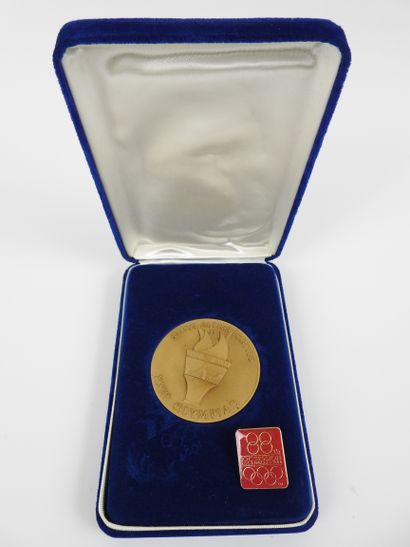 null Olympic Games. Los Angeles 1984. Two pieces: a) medal of participant, obverse,...
