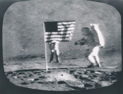null Nasa. "Stars and Stripes" on the Moon. Astronaut Gene Cernan on the right has...