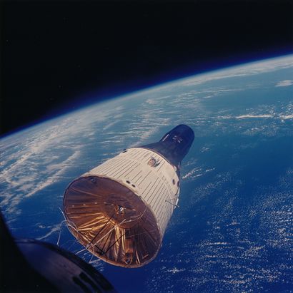null NASA. This photograph of the Gemini Titan 7 spacecraft was taken from the Gemini...