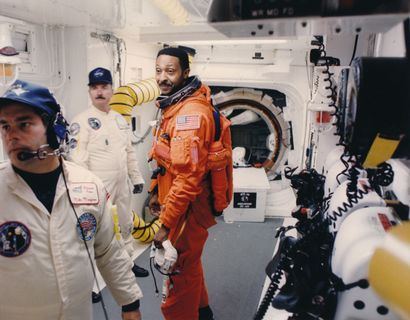 null Nasa. Scientist Winston E. Scott (center) prepares to re-enter Space Shuttle...