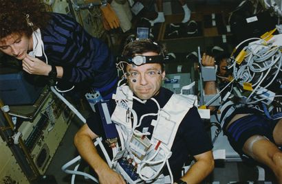 null Nasa. Medical experiment in space. Astronaut Robert B. Thirsk carries experimental...
