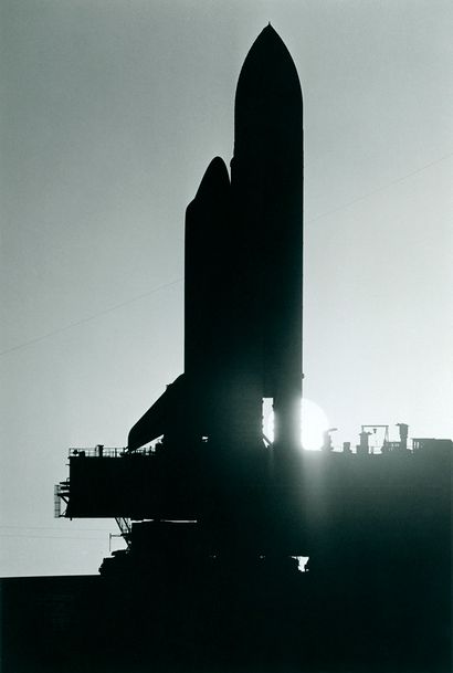null NASA. Perfect silhouette of the space shuttle on its transport cart between...