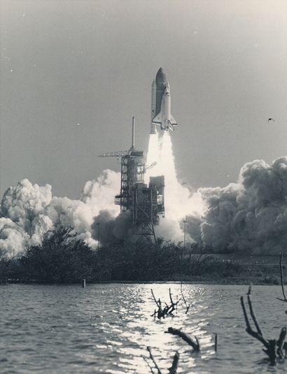 null Nasa. Above a pillar of flames, the space shuttle Challenger rises above its...