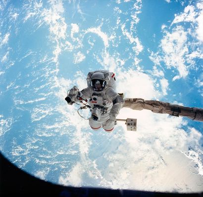 null Nasa. Suspended at the end of the articulated arm of the space shuttle Endeavour...