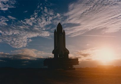 null NASA. Pictorial sunrise in front of the impressive silhouette of the space shuttle...