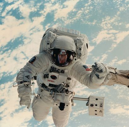 null NASA. Astronaut Michael L. Gernhardt is photographed during a spacewalk while...