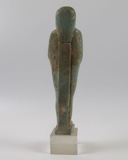 null Oushebti carrying farming tools. Sky blue frit. L 12 cm. Ptolemaic period (circa...