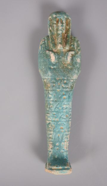 null Oushebti inscribed.
Frit. In the state of the missing foot. H :19cm.