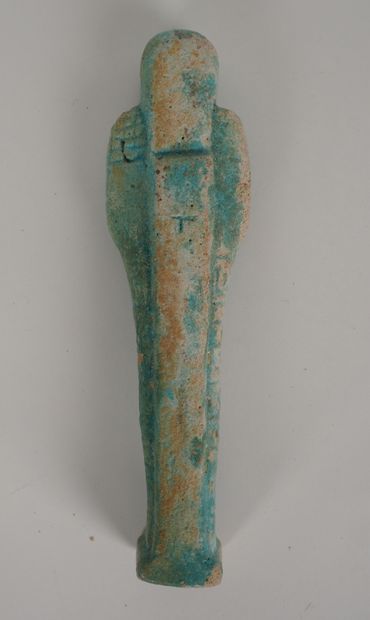 null Oushebti inscribed with blue frit.665-332 B.C.In the state.Misses.
H :approx18...