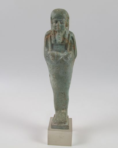 null Oushebti carrying farming tools. Sky blue frit. L 12 cm. Ptolemaic period (circa...