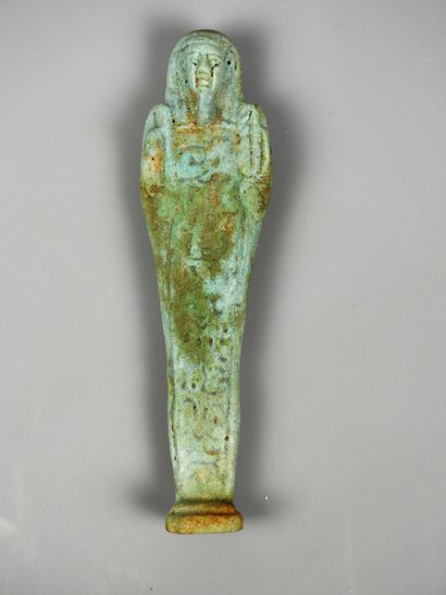 null Inscribed oushebti, frit or glass paste, height 15.5 cm.
Late period, 665-332...
