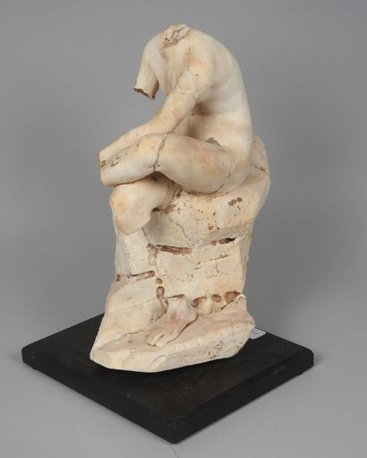 null Headless statue representing the Goddess Venus sitting on a rock in the attitude...