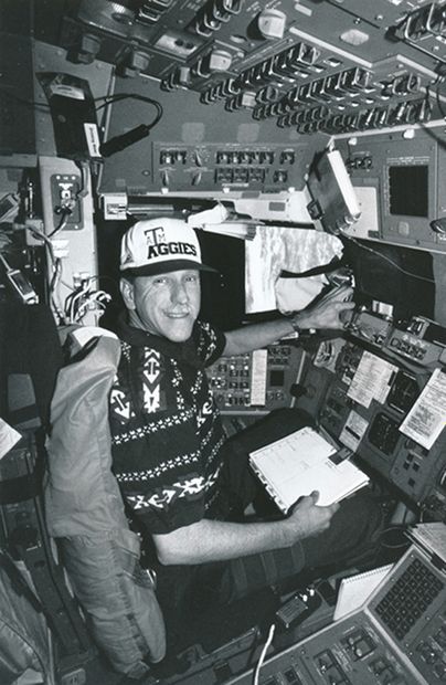NASA NASA. A space shuttle pilot pictured in the cockpit of a space shuttle. Circa...