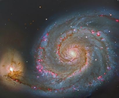 NASA Astrophysical photograph from Earth showing the M51 galaxy or "Whirlpool" galaxy...