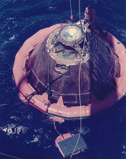 NASA Nasa. Apollo mission. The command module capsule of the Apollo mission is hoisted...
