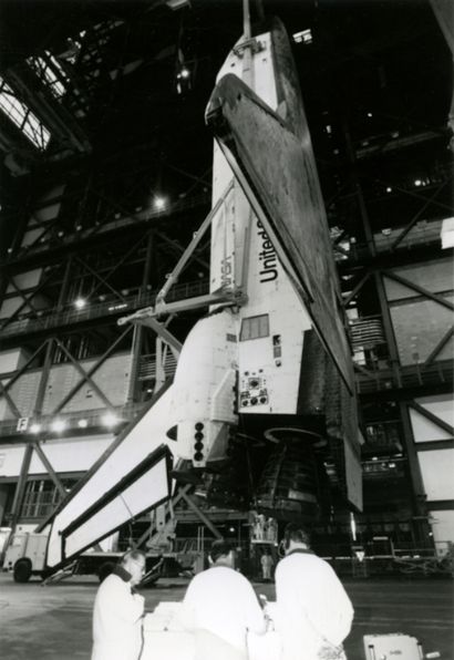 NASA Nasa. Rare photograph of the space shuttle suspended vertically in its assembly...