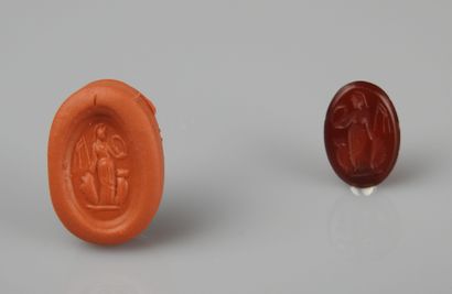 null Very nice intaglio representing Athena, or a victory, holding attributes

Carnelian...
