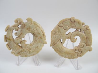 null Two amulets with coiled phoenix and dragon. Serpentine. D 7cm. China.