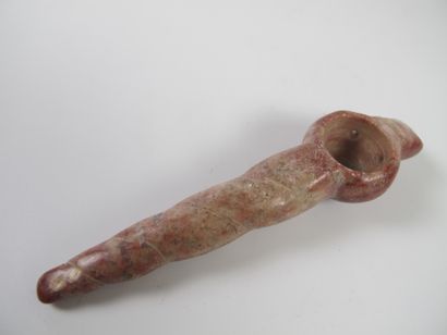 null Pendant in the shape of a shell with a long columella. Ceremonial spoon. Red...