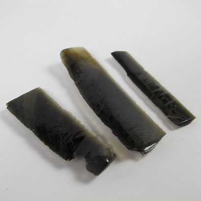 null Three obsidian blades, sickle elements. L 5.5 to 7.5cm. Presented on a 3D frame...