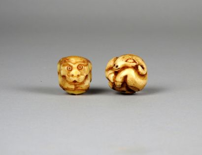 null Two bone beads, astrological sign of the goat and the monkey (crack of antiquity).

In...