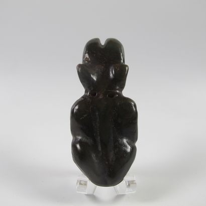 null Jade amulet with crouching shamanic figure. Nephrite. L 8cm. China. Style of...
