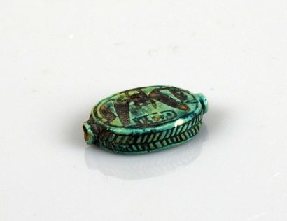 null Oval bead decorated with hieroglyphs and cartouches

Frit 2 cm

Egypt Late Period...