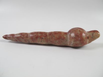 null Pendant in the shape of a shell with a long columella. Ceremonial spoon. Red...