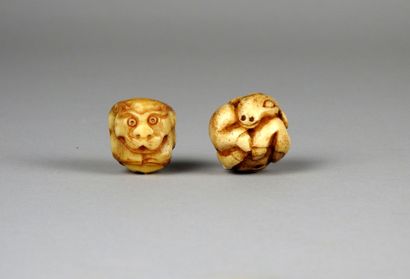 null Two bone beads, astrological sign of the goat and the monkey (crack of antiquity).

In...