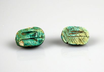 null Set of two inscribed scaraboid beads

Frit and various 1.3 cm

Egypt style of...
