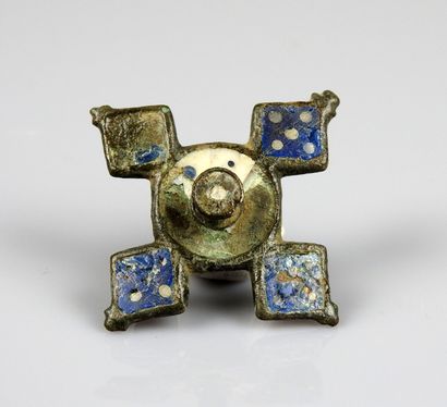 null Cruciform fibula with blue enamels in diamond-shaped boxes around a central...
