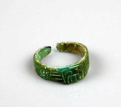 null Ring decorated with a stylized animal, probably a horse

Bronze Finger size...