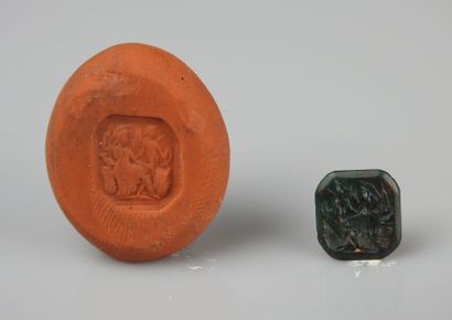 null Intaglio representing a seated helmeted goddess with a victory in front of her

Black...