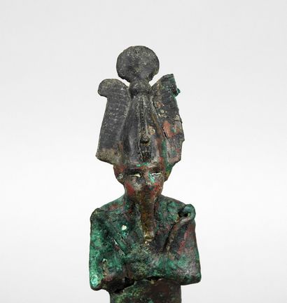 Osiris carrying the farming tools and the...