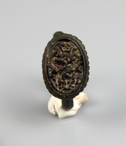 null A superb seal ring with intaglio decoration representing two horses facing each...