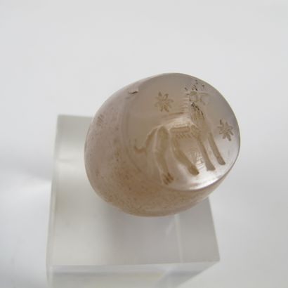 null A chalcedony bead seal carved in intaglio with a griffin in the Sassanid Persian...