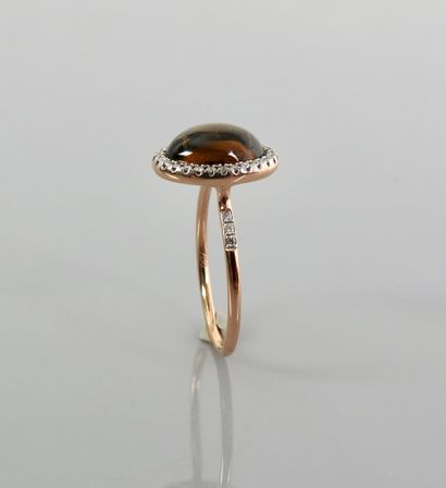 null Pink gold ring, 750 MM, centered on a golden tourmaline cabochon weighing about...