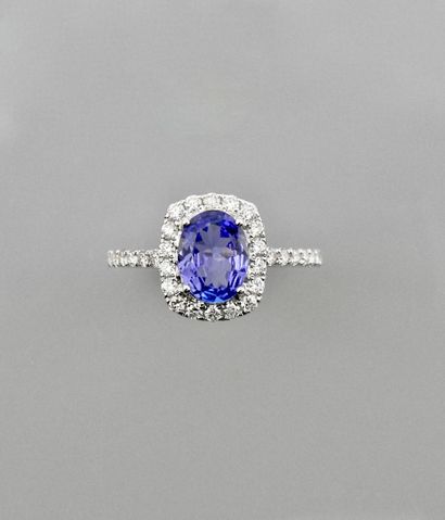 null White gold ring, 750 MM, centered on an oval tanzanite weighing approximately...