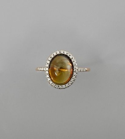 null Pink gold ring, 750 MM, centered on a golden tourmaline cabochon weighing about...