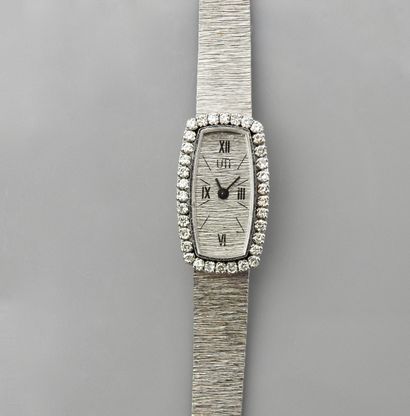 null UTI, Bracelet montre de dame en or gris, 750 MM, fond or gris, lunette tonneau,...
