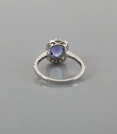 null White gold ring, 750 MM, centered on an oval tanzanite weighing approximately...