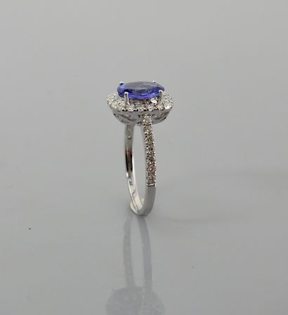 null White gold ring, 750 MM, centered on an oval tanzanite weighing approximately...